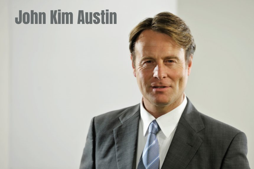 AI-generated illustration of a man in a gray suit, light blue shirt and striped tie against a light gray background, captioned John Kim Austin
